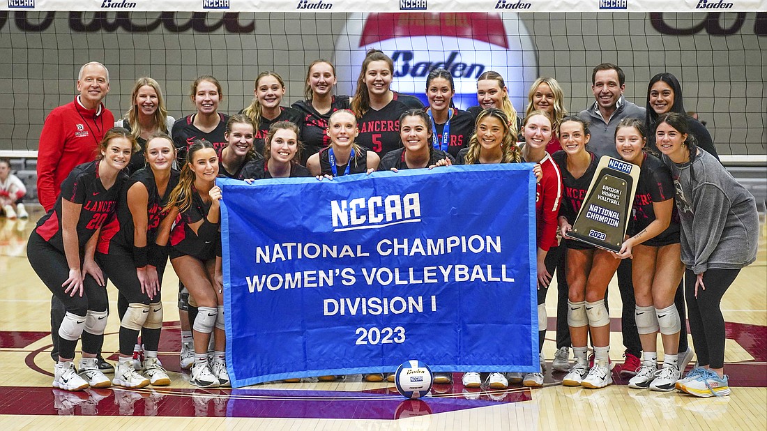 Pictured is Grace's volleyball team holding the banner after winning the 2023 NCCAA national championship