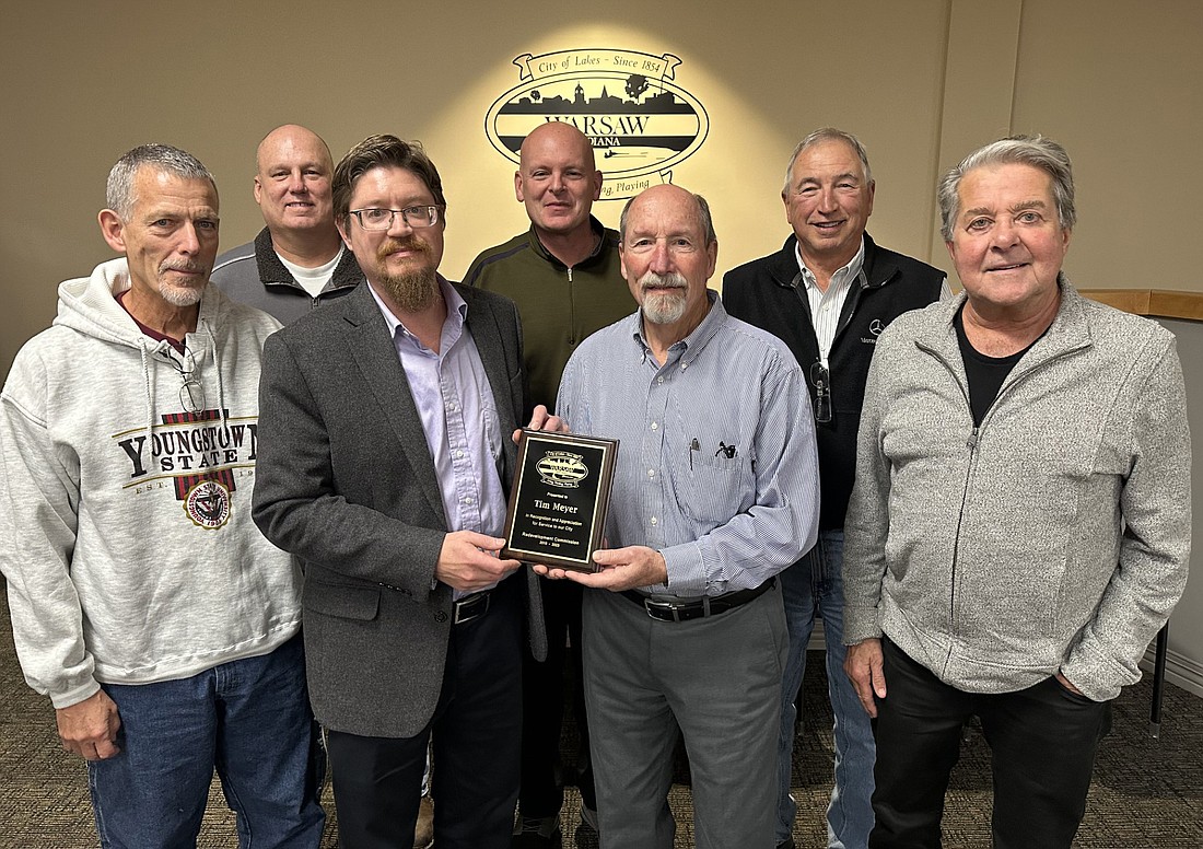 Monday’s Warsaw Redevelopment Commission meeting was the last one for President Tim Meyer as he has stepped down from serving on the commission after 13 years. Community and Economic Development Director Jeremy Skinner and the rest of the commission recognized and thanked him for his years of service. Pictured (L to R) are, front row: Commission member Bill Curl, Skinner, Meyer, Commission member George Clemens; back row: Warsaw Community Schools Board representative to the commission Brad Johnson and Commission members and Councilmen Jeff Grose and Mike Klondaris. Photo by David Slone, Times-Union