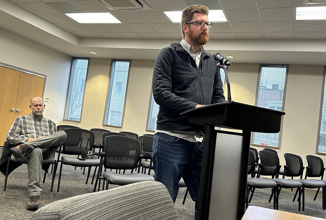 Brian Smith (R) asks the Warsaw Redevelopment Commission a number of questions Monday about the sublease on the third shell building at the Warsaw Tech Park with West Hill Development. Sitting behind him is Cary Groninger, a partner with West Hill Development. Photo by David Slone, Times-Union