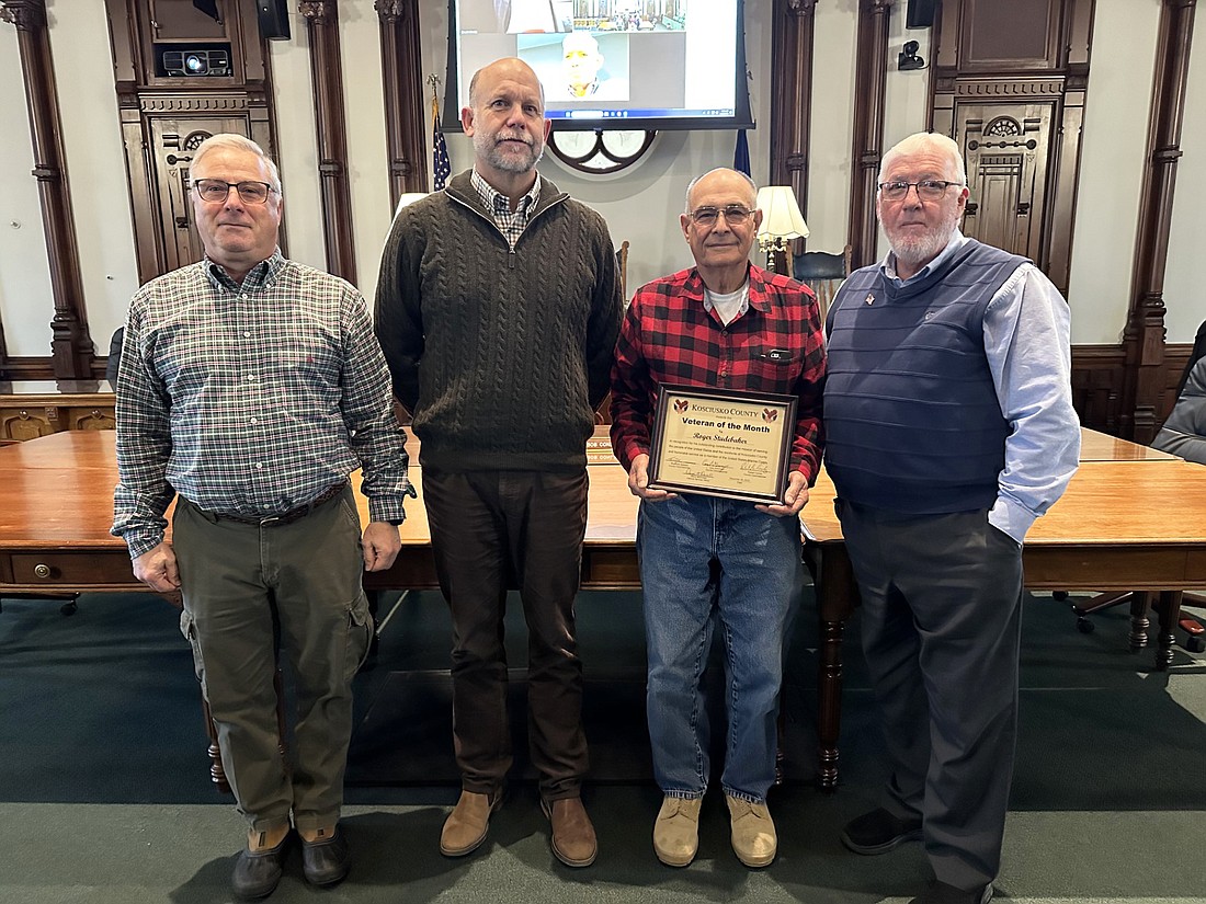 Roger Studebaker, a Marine who served in Vietnam, is the December 2023 Kosciusko County Veteran of the Month. He was recognized at Tuesday’s Kosciusko County Commissioners meeting. Pictured (L to R) are Darryl McDowell, county veteran service officer; Cary Groninger, county commissioner; Studebaker; and Bob Conley, commissioner. Photo by David Slone, Times-Union