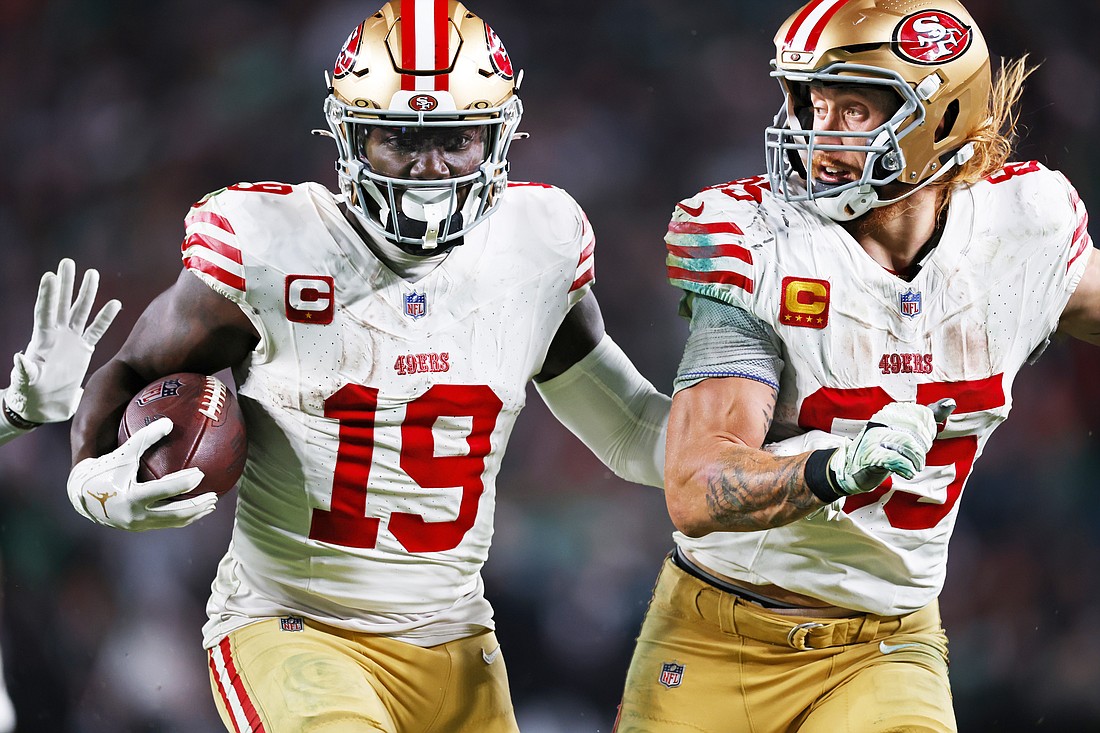 San Francisco 49ers wide receiver Deebo Samuel (19) runs into the end zone for a touchdown with tight end George Kittle (85) after making a catch during the third quarter of a NFL football game against the Philadelphia Eagles, Sunday, Dec, 3, 2023, in Philadelphia. the 49ers defeated the Eagles 42-19. (AP Photo/Rich Schultz)