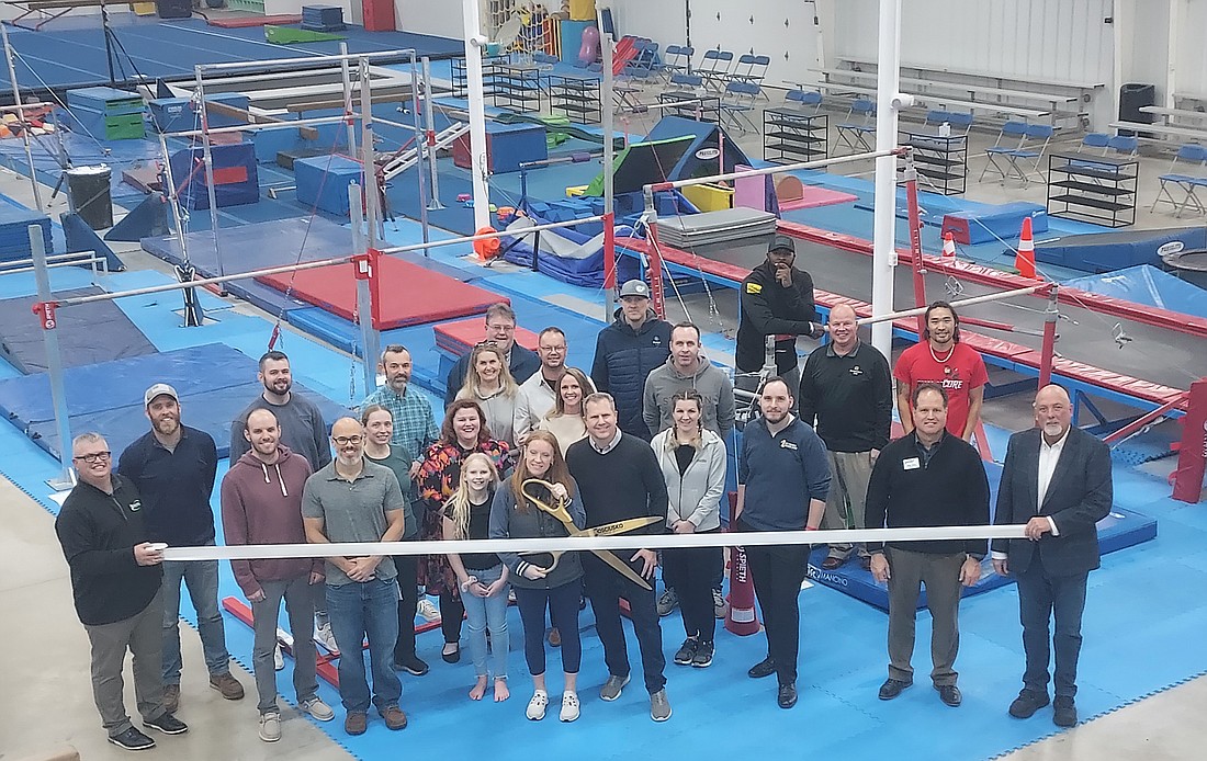 Kosciusko Chamber of Commerce held a ribbon-cutting for Lake City Gymnastics, 610 E. Bell Drive, Warsaw, Friday. Pictured are Chamber staff and ambassadors and Lake City Gymnastics staff. Photo by Jackie Gorski, Times-Union