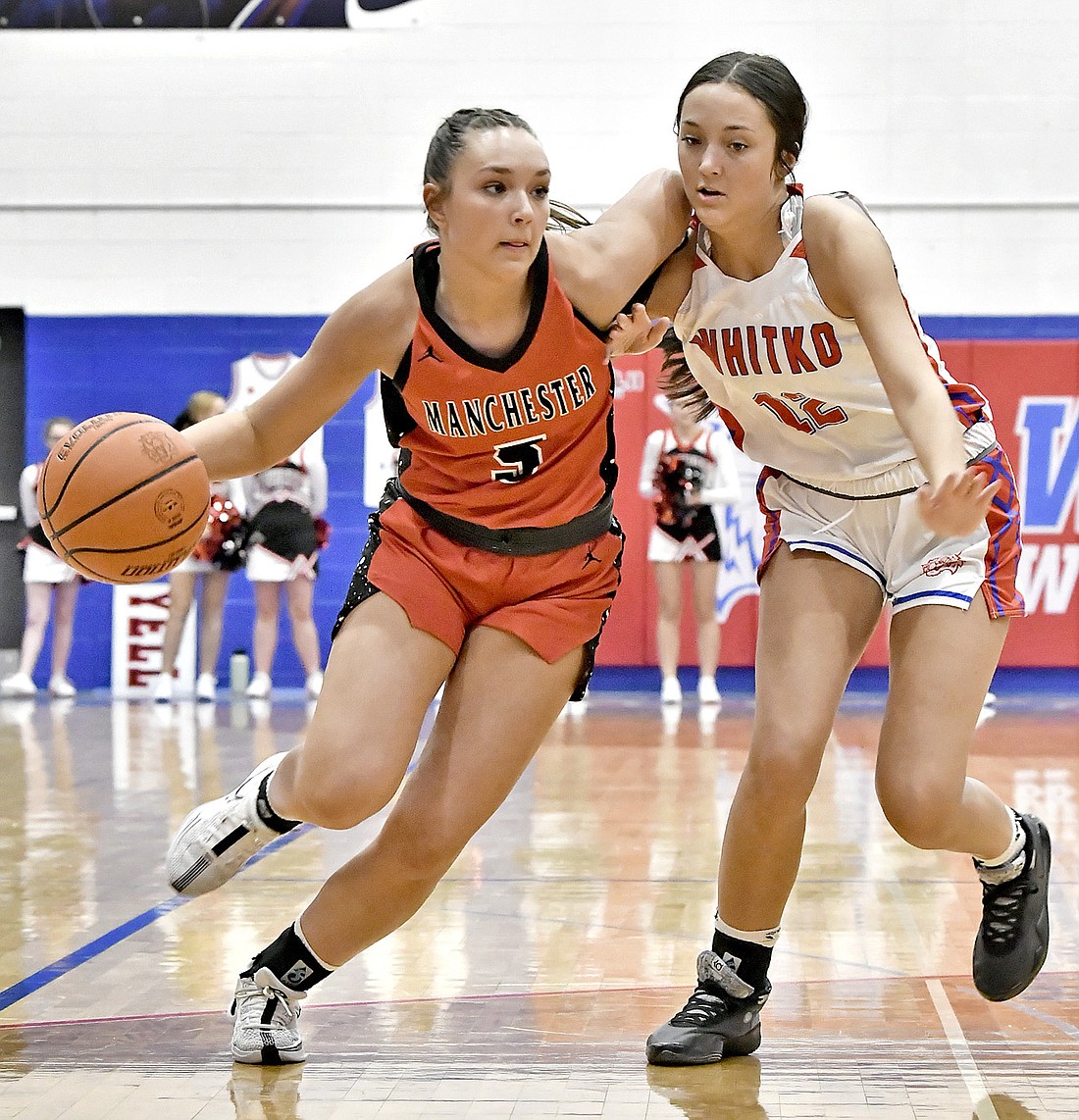 Manchester junior Brookelynn Buzzard tries to get around Whitko's Kloe Krieg during the first quarter. Photo by Gary Nieter