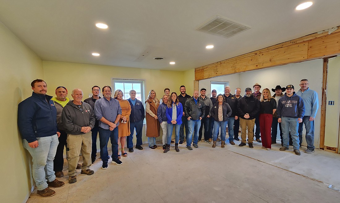 Shown are representatives of all the local businesses who donated time, talent, materials and finances in the remodel the Syracuse-Wawasee Chamber of Commerce offices. The group is shown in the chamber office, where work is currently under way. Pictured (L to R) are, front: Erik Parcell, R Yoder Construction; Steve Williams, Shades to Shutters; Mark Phillabum, Polywood, Leading Edge and Jasper Plastics; Krista Bontrager, Dynamic Landscaping; Andrew Miller, Legacy Wood Creations; Rachael Rhoades, Cottage Watchman; Bruce Jackson, T. L. Jackson; Gabe Ritter, Ritter Electric; Ashley Dillon, chamber executive director; and Eddy Reynoso Jr.; Eddy's Dry Wall; back: Dan Stuckman, Drop Box Storage; Seth Helser, J. Lane Flooring and Design; Amanda Lease, J. Lane Flooring and Design; Larry Coplen, Coplen Construction; Tricia Small, Teghtmeyer Ace Hardware; Crystal Knafel, Dynamic Landscape; Cullen Fervida, Himco; Patrick Olson, Maumee Paint and Supply; Glen Farmwald, Glen's Diamond Tile; Hector Alvarado, Northern Lakes Painting; Matt Buhrt, Buhrt Buildings; John Kidd, R. W. Kidd Construction; Eddy Reynoso, Eddy's Drywall; and Jeff Dyson, chamber president. Not present were representatives from Milestone Construction, Pack Rat Storage, L.T. Siding, Builders Mart, Harter Custom Construction and Wawasee High School Building Trade. Photo by Deb Patterson, InkFreeNews