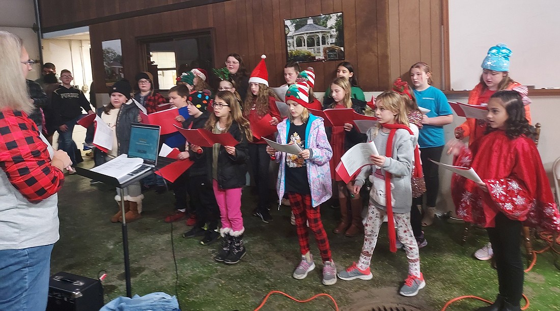 The Leesburg Elementary School choir performs during the Leesburg Christmas party Saturday at the old Leesburg fire station. Photo by Jackie Gorski, Times-Union