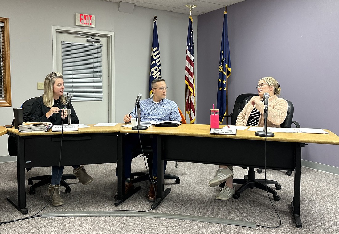 Winona Lake Town Council members Ashley McGinnis (L) and Barry Andrew listen to answers from Clerk-Treasurer Heather James at a special meeting Monday. Photo by David Slone, Times-Union