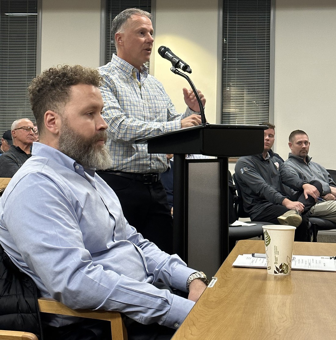 Jeff Thomas, co-owner and vice president of Oakmont Development, the developer for the Asherwood planned unit development, speaks to the Warsaw Plan Commission Monday. City Planner Justin Taylor is sitting in the forefront. Photo by David Slone, Times-Union