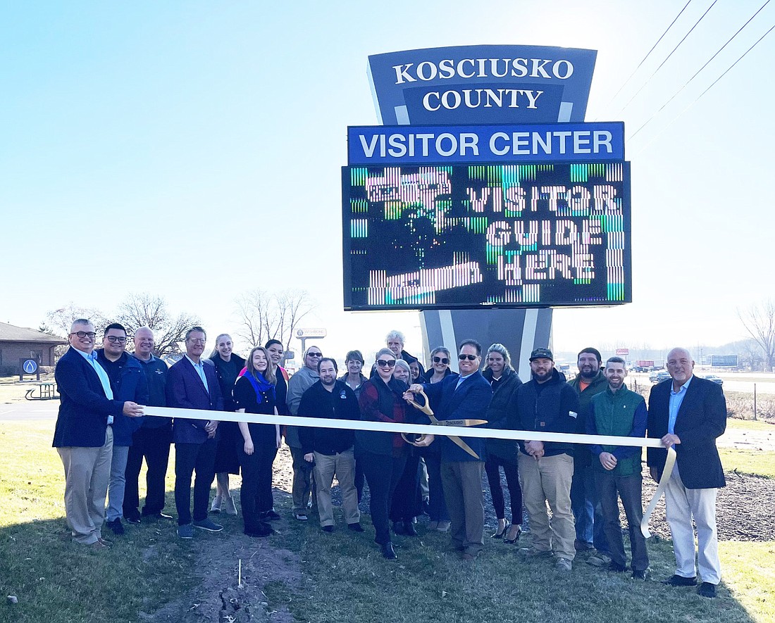 Kosciusko County Visitors Bureau celebrate their new sign with a ribbon-cutting on Wednesday. Photo by Brianna Pitts, InkFreeNews