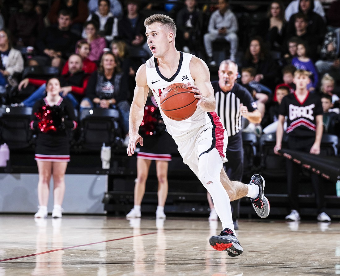 Pictured is Carter Stoltzfus handling the ball for No. 1 Grace's men's basketball team. Photo by Jeff Nycz