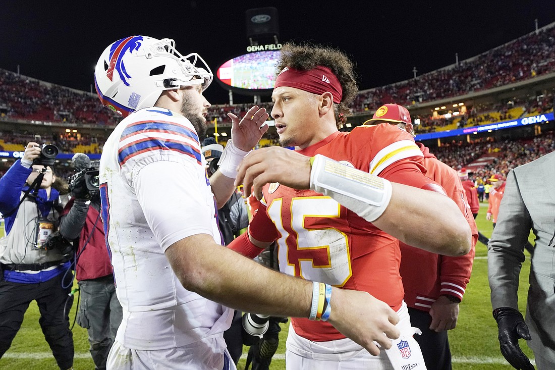 Buffalo Bills quarterback Josh Allen, left, and Kansas City Chiefs quarterback Patrick Mahomes (15) shake hands following an NFL football game Sunday, Dec. 10, 2023, in Kansas City, Mo. The Bills won 20-17 (AP Photo/Ed Zurga)