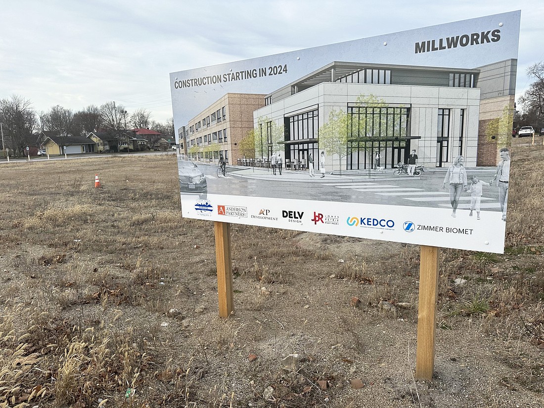 A sign on the former Owens property touts the forthcoming mixed-used development. Photo by David Slone, Times-Union