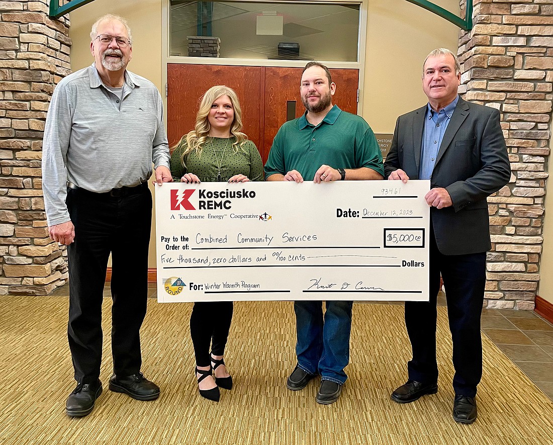 Shown is Kosciusko REMC CEO and President Kurt Carver presenting Combined Community Services with a $5,000 check for their Winter Warmth Program. Pictured (L to R) are Randy Polston, CCS executive director; Kiira Churchill, CCS director of development; Tim Frame, CCS director of emergency assistance; and Carver. Photo Provided