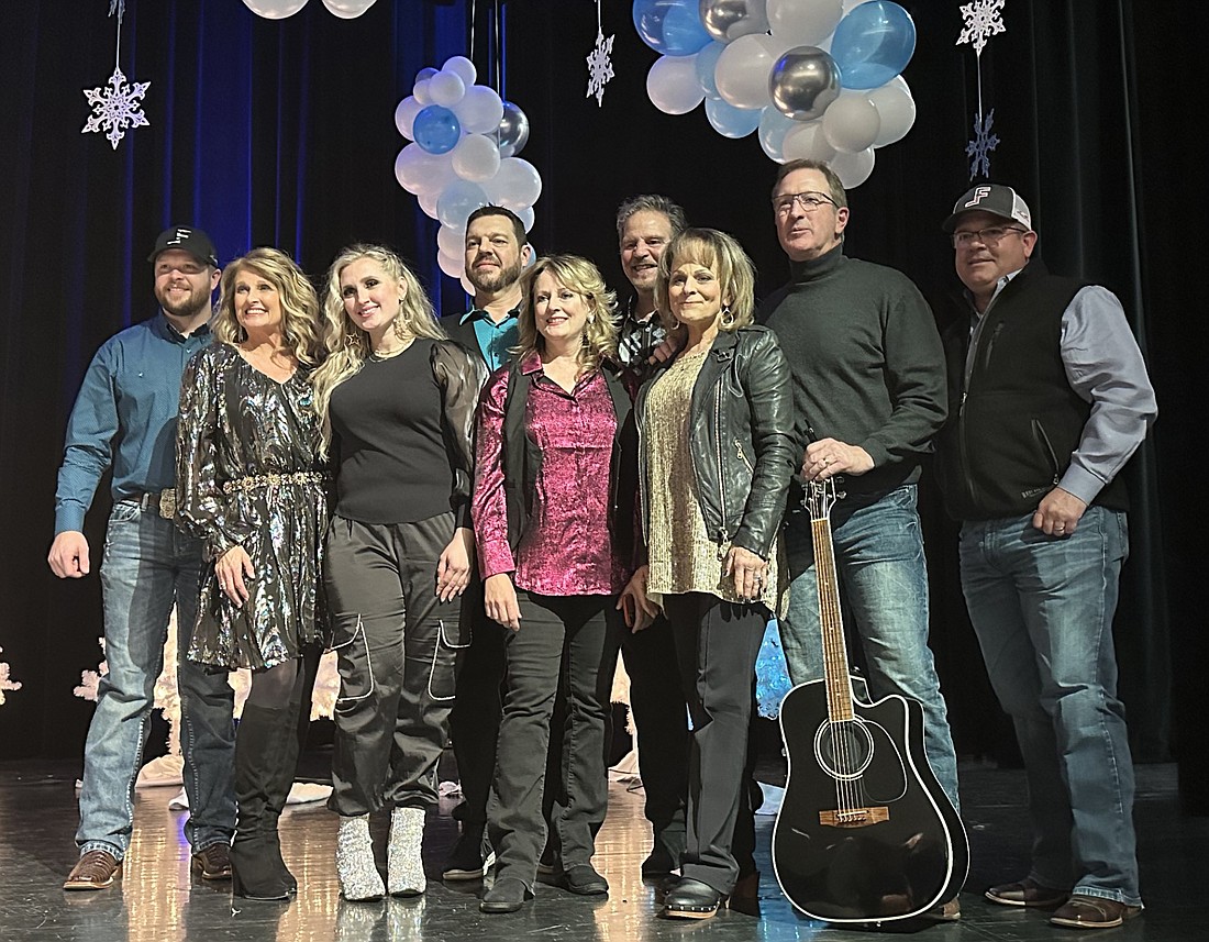 All the performers from A Country Christmas with Susie McEntire pose for a group photo after Saturday’s concert at Lakeview Middle School, along with Atoka, Okla., Mayor Brian Cathey. Pictured (L to R) are Clay Edwards, Linda Davis, Keenie Word Moore, Scott Thompson, Jenifer Wrinkle, Lang Scott, Susie McEntire, Mark Eaton and Cathey. Photo by David Slone, Times-Union