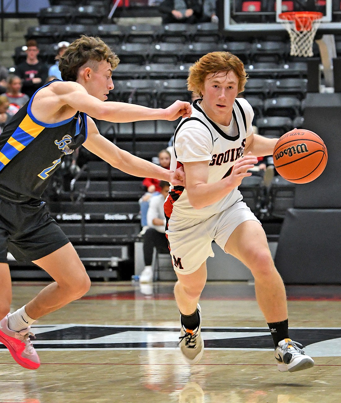 Manchester senior Tyler McLain races into the forecourt during the second quarter of Saturday night's game against Blackhawk Christian. Photo by Gary Nieter