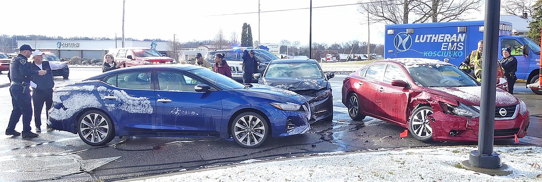 Emergency personnel arrive at the scene of Monday morning's three-vehicle accident in front of Martin's on Husky Trail. Photo by Gary Nieter, Times-Union