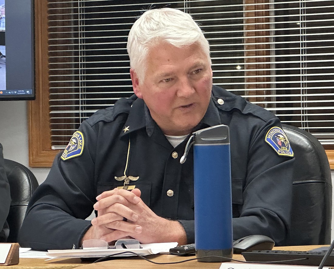 Winona Lake Police Chief Joe Hawn tells the Winona Lake Town Council Tuesday about a grant he wants to apply for that could mean two or three electric vehicles for his police department, plus outfitting and equipment.  Photo by David Slone, Times-Union