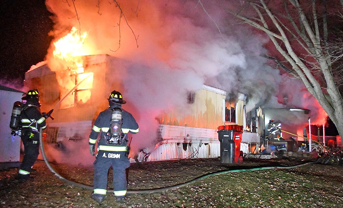 Multiple area fire departments had their hands full overnight with a mobile home fire at Regancy Estates, east of Pierceton. Photo by Gary Nieter, Times-Union