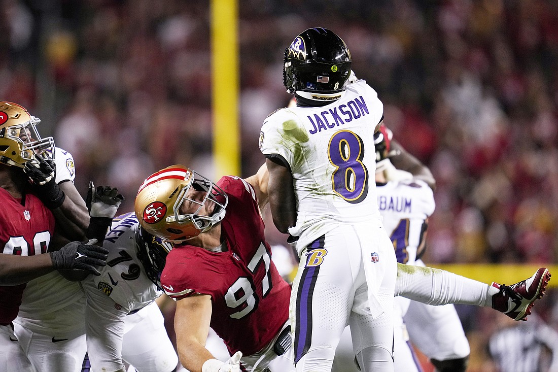 San Francisco 49ers defensive end Nick Bosa (97) pressures the pass by Baltimore Ravens quarterback Lamar Jackson (8) during the first half of an NFL football game Monday, Dec. 25, 2023, in Santa Clara, Calif. (AP Photo/Godofredo A. Vásquez)