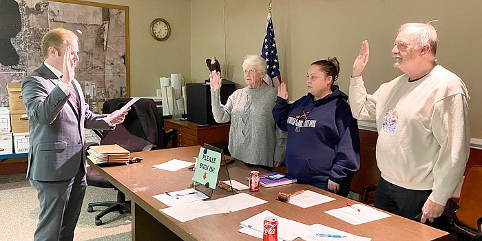 Silver Lake town attorney Austin Rovenstine, far left, swears in (L to R) Council members Jean Weller, Nichole Taylor and Hugh Murfin. Photo by Leah Sander, InkFreeNews.