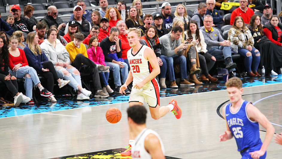 Grace’s Jake Wadding dribbles the ball up the court at Gainbridge Fieldhouse, home of the Indiana Pacers. Photo by Grant Cook