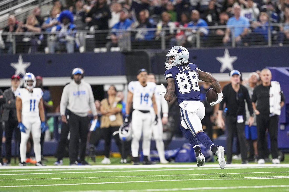 Dallas Cowboys wide receiver CeeDee Lamb runs after making a catch while scoring on a long touchdown against the Detroit Lions during the first half of an NFL football game, Saturday, Dec. 30, 2023, in Arlington, Texas. Lamb was a massive factor in sports editor Connor McCann’s fantasy football team, Drake’n the Kincaid, winning the title. (AP Photo/Sam Hodde)