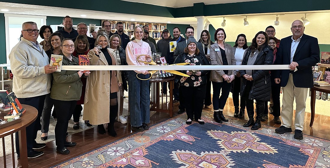 On Thursday, the Kosciusko Chamber of Commerce held a ribbon-cutting ceremony for The Word House bookstore inside the Winona Live building at 25 Kings Hwy., Winona Lake. Pictured is The Word House owner, Sarah Wordhouse (C), cutting the ribbon, surrounded by Chamber staff, ambassadors and board members. Photo by David Slone, Times-Union