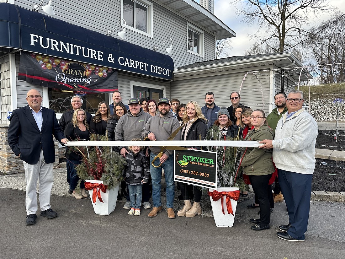 Kosciusko Chamber of Commerce had a ribbon-cutting ceremony Thursday for Stryker Lawn Service LLC, whose office has moved into the Winona Live building at 25 Kings Hwy., Winona Lake. Photo by David Slone, Times-Union