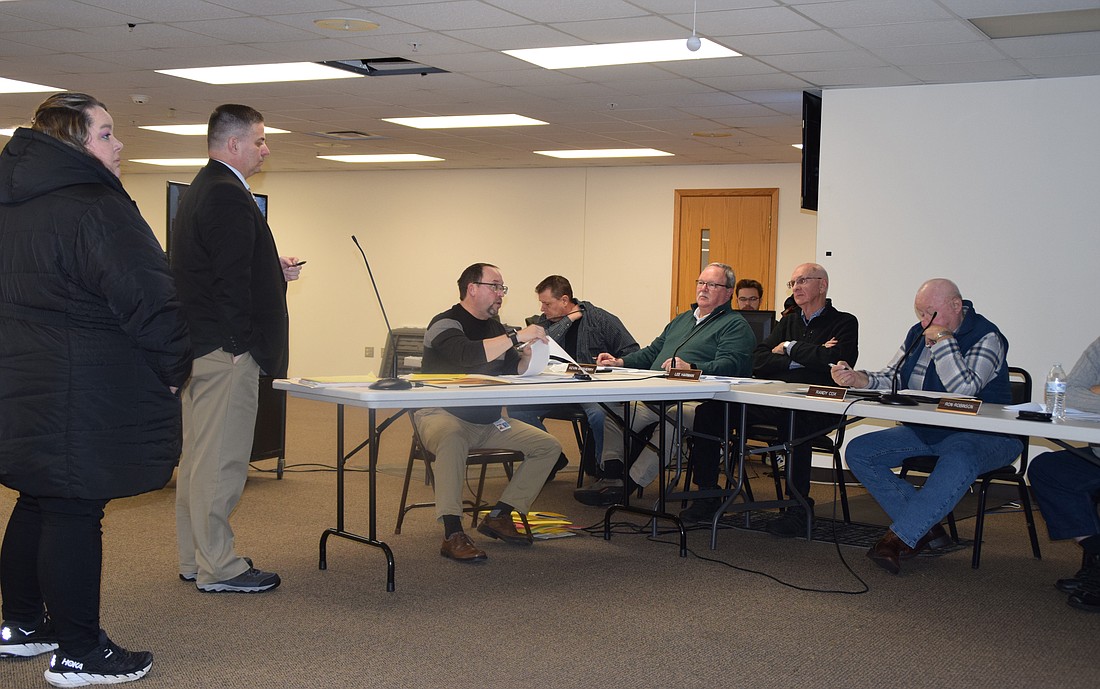 Pictured at the Kosciusko County Board of Zoning Appeals meeting are Ashlee Ryman (L) and her attorney, Andrew Grossnickle; Matt Sandy (in the middle), area plan director; and BZA members John Beer, Kevin McSherry, Lee Harman and Randy Cox. Seen in the very back is Andy Heltzel, assistant planner. Photo by Lauren Zeugner, InkFreeNews