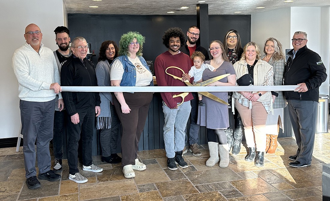 Three Crowns Coffee had a ribbon-cutting ceremony with the Kosciusko Chamber of Commerce Thursday for Three Crowns Coffee’s new second location in the Winona Live building at 25 Kings Hwy., Winona Lake. Pictured are owners Obadiah and Sarah Clemans (with scissors), Chamber staff and Chamber ambassadors inside the coffee shop. Photo by David Slone, Times-Union