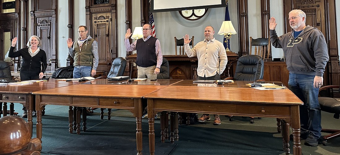 Kosciusko County Department of Parks and Recreation Board members (L to R) Aggie Sweeney, Troy Turley, Rob Bishop, Matt Metzger and Mike Cusick are given the oath by board secretary and county Auditor Rhonda Helser (not pictured) Thursday. Bishop will continue to serve as president for 2024, with Sweeney as vice president. Photo by David Slone, Times-Union