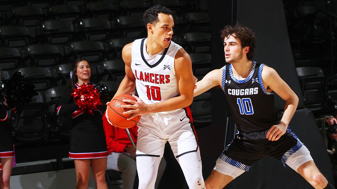 Pictured is Grace's Jakob Gibbs surveying the floor during the second half of the Lancers' dominant victory on Wednesday.