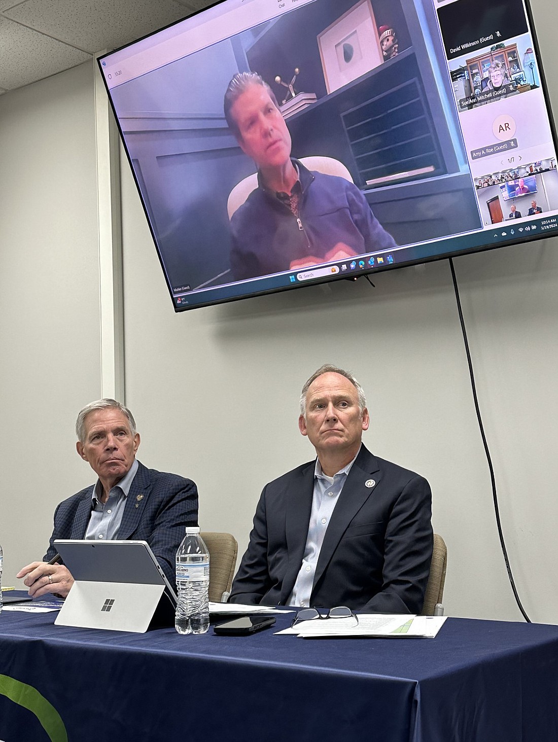 State Reps. David Abbott (L) and Craig Snow (R) listen to Indiana Sen. Ryan Mishler on one of the television monitors Friday during the Kosciusko Chamber of Commerce’s Legislative Review Session. Photo by David Slone, Times-Union