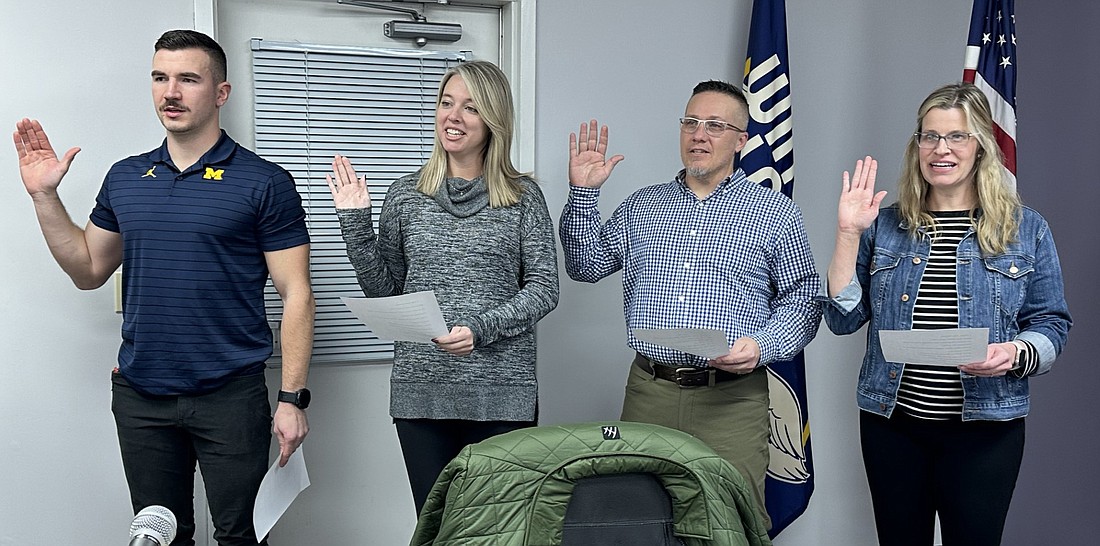 Taking the oath of office Tuesday during the Winona Lake Town Council meeting are (L to R) Council members Austin Reynolds, Ashley McGinnis and Barry Andrew and Clerk-Treasurer Heather James. Photo by David Slone, Times-Union