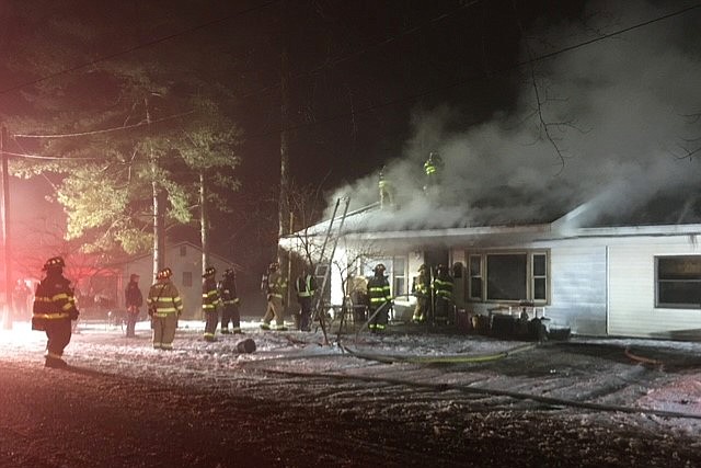 Burket and Mentone fire departments battled a blaze Tuesday night for three hours at 4936 W. Lakeview Park Drive, Warsaw. No injuries were reported, but the occupants reported the loss of a pet cat due to smoke inhalation. Photo Provided by Kevin McSherry