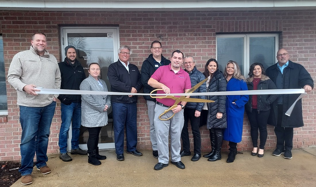 Pictured (L to R) are Chad Hummel, Silveus Insurance; John Vida, Rabb Water; Heather Lardino, 1st Source Bank; Glenn Hall, Stillwater Hospice; Ben Snyder, Guidepost Insurance; Dan Cervantes, owner of The Healing Road; Kurt Carlson, Heirloom Woodworks; Raquel Kline, Paddock Springs; Stacy Leek, Stillwater Hospice; Rachael Rhoades, Cottage Watchman Security; and Scott Wiley, Kosciusko Chamber of Commerce member relations manager. Photo by Jackie Gorski, Times-Union