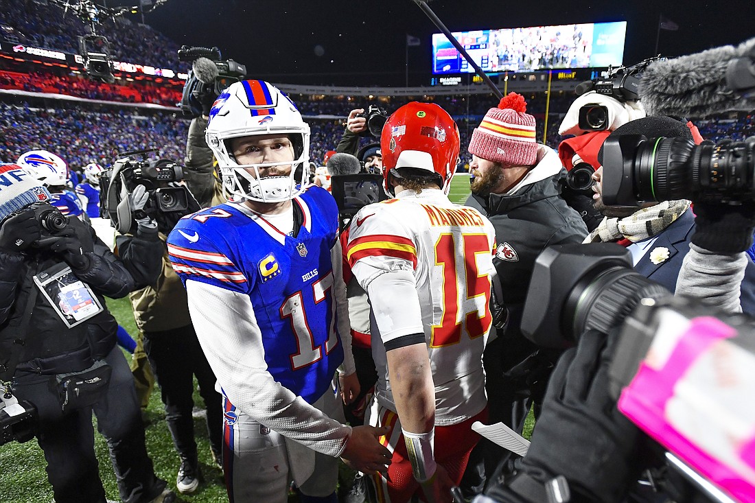 Buffalo Bills quarterback Josh Allen (17) greets Kansas City Chiefs quarterback Patrick Mahomes (15) after playing in an NFL AFC division playoff football game in Orchard Park, N.Y., Sunday, Jan. 21, 2024. (AP Photo/Adrian Kraus)