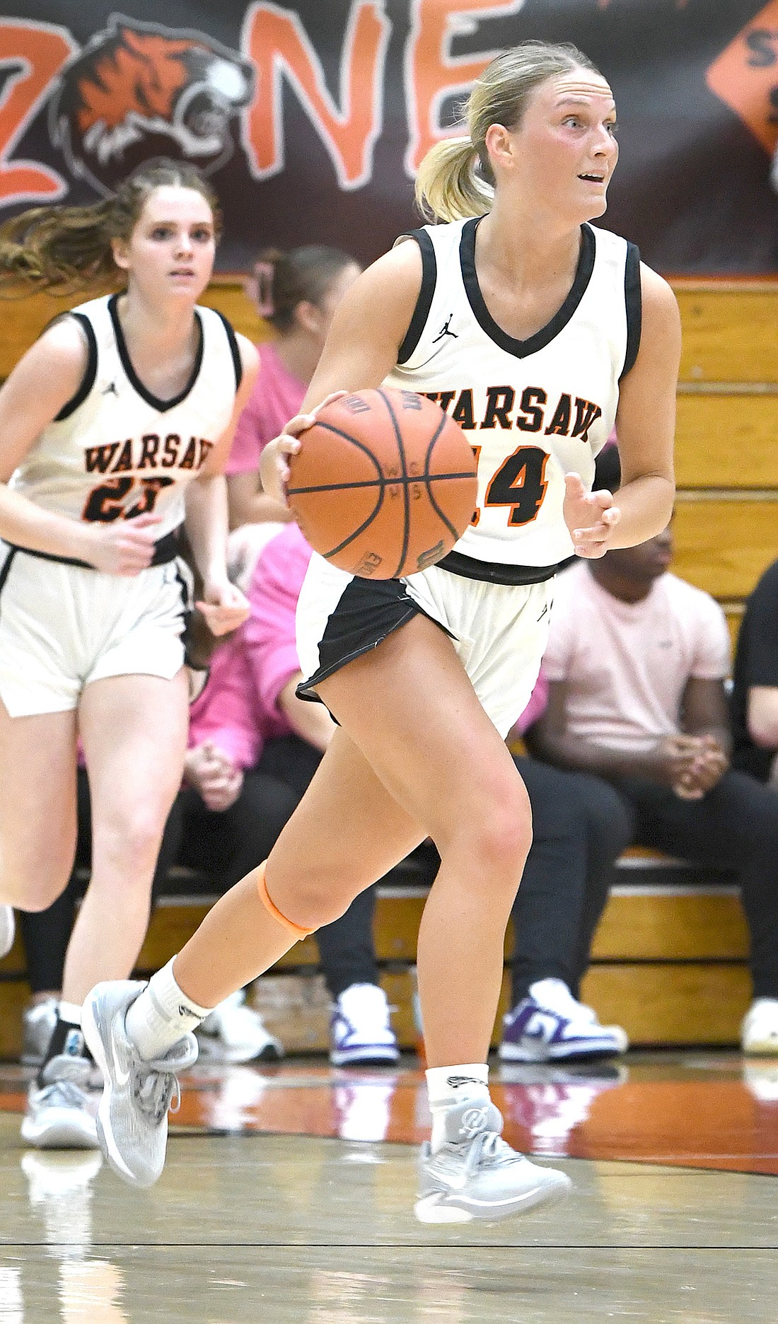 Senior Dalaney Vilamaa of Warsaw takes flight while leading a fast break during Thursday night's home game against Angola. Photo by Gary Nieter