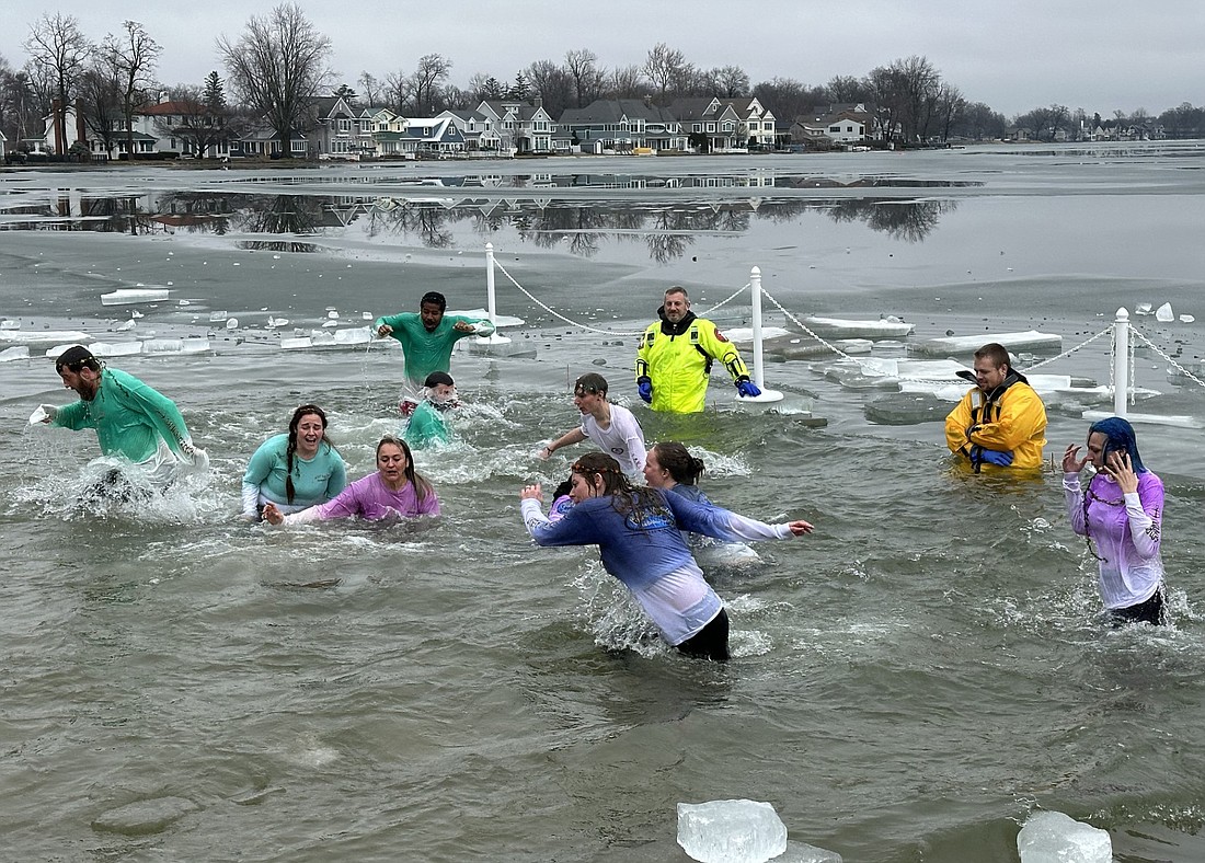 The last group to take part in the Oakwood Resort Polar Plunge on Saturday were employees of the hotel. Photo by David Slone, Times-Union