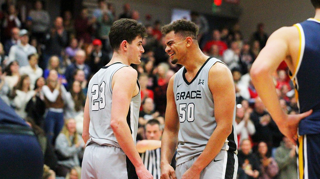 Pictured is Ian Scott (left) and Elijah Malone (right) celebrating Malone's late score during Grace's comeback over Marian on Saturday