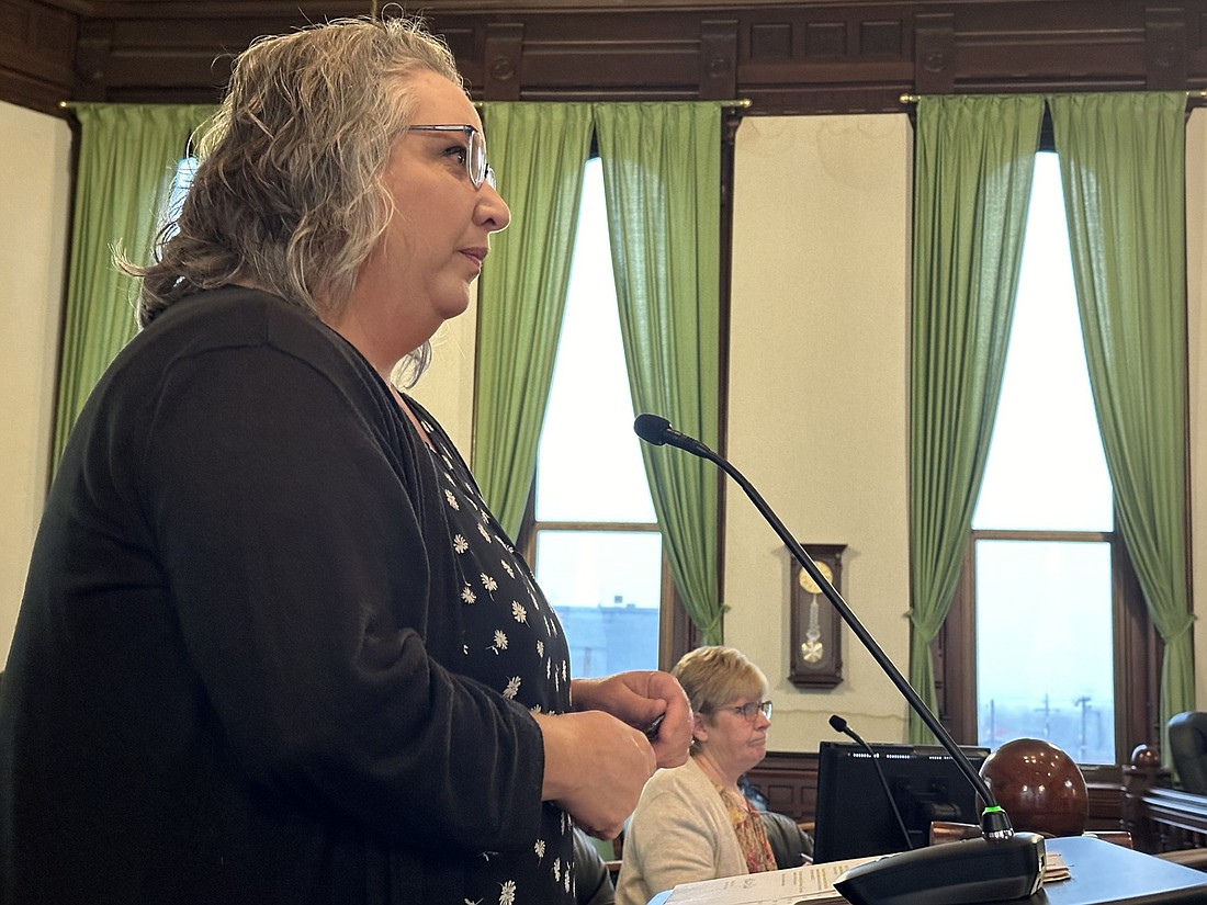 Kosciusko County Treasurer Michelle Puckett informs the commissioners on how much money the county earned through interest on its investments Tuesday. Seated next to her is County Auditor Rhonda Helser. Photo by David Slone, Times-Union