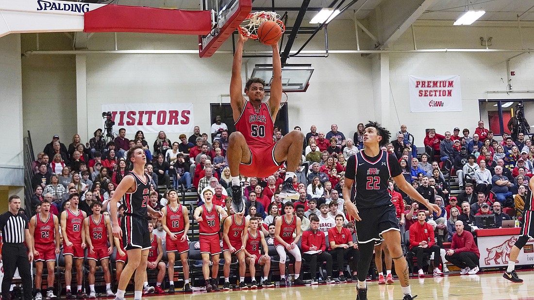 Pictured is Elijah Malone throwing down a dunk during No. 1 Grace's rout of No. 5 IWU on Wednesday