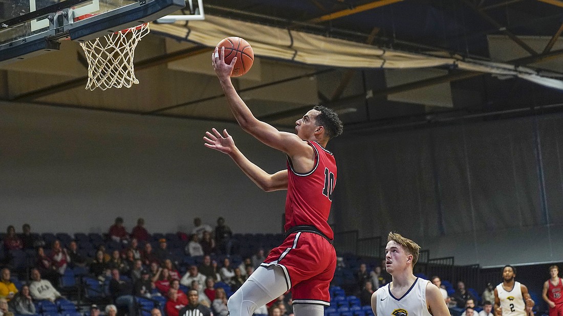 Pictured is Jakob Gibbs rising for a layup during Grace's win on Saturday.