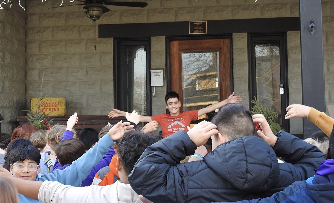 Jefferson Elementary School sixth-graders visit Israel Gagnon for an air hug. Photo Provided.