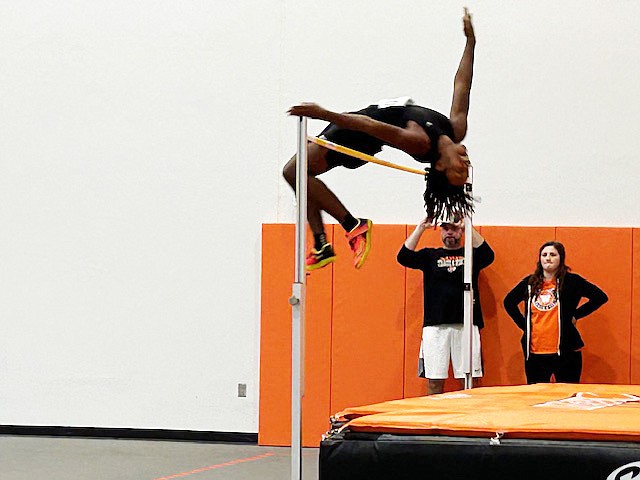 Pictured is Warsaw’s Jordan Randall competing in the high jump event at a showcase event at Warsaw on February 2. Randall set a school record at the even, clearing 6’-9.25”.