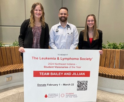 Jillian Culp and Bailey Wolfe, Whitko Leukemia & Lymphoma Society Student Visionaries, are pictured with Dr. Matthew Bartock, DO. Photo Provided