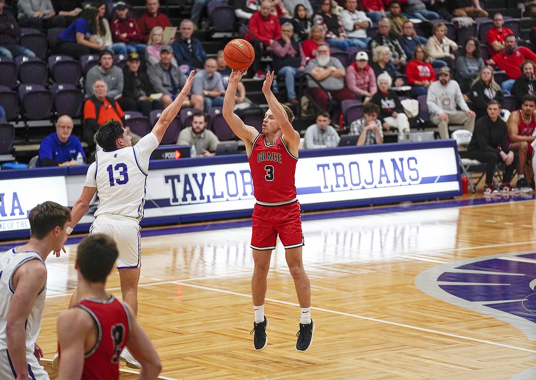 Pictured is Brett Sickafoose hitting a 3-pointer during No. 1 Grace's win on Wednesday at Taylor