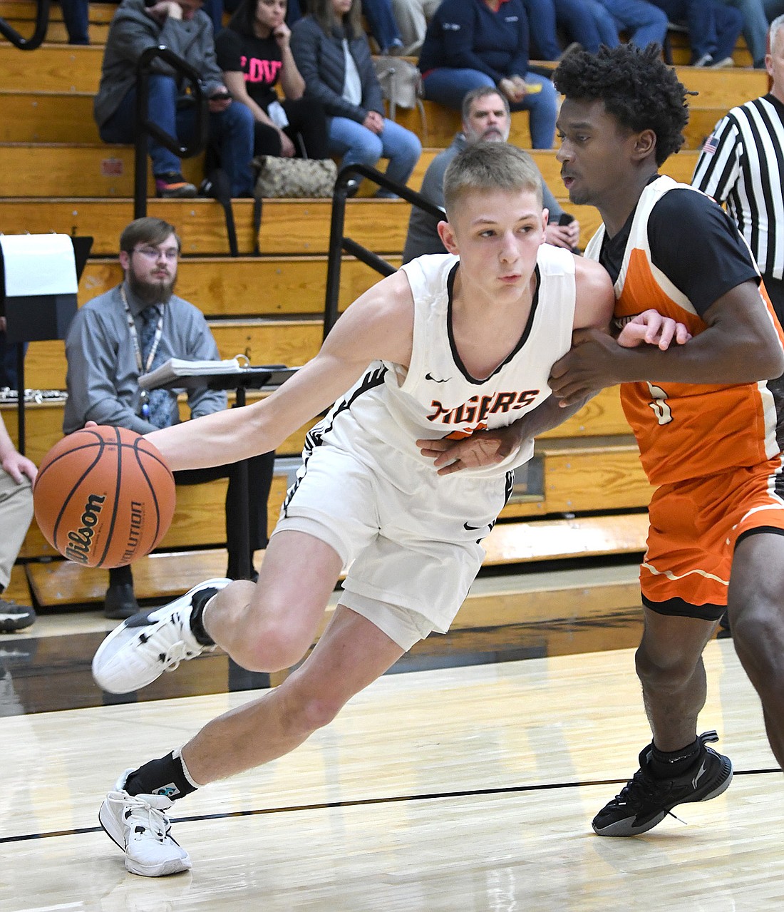 Warsaw junior Luke Bricker drives to the basket during Tuesday night's final home game against Northrop. Photo by Gary Nieter