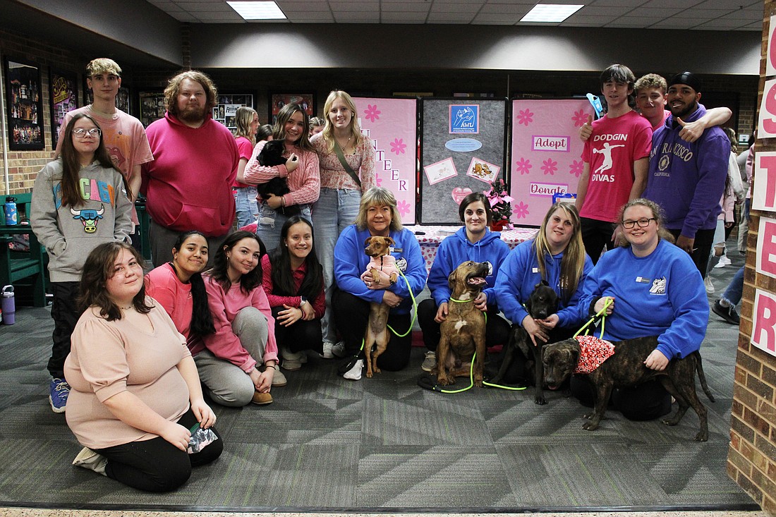 Pictured (L to R) are, front row: Wawasee High School students Madison Greer, Justine Martinez, Mackenzie Michael, Ciara Rodriguez, Animal Welfare League Executive Director Tonya Blanchard and AWL volunteers; back row: WHS students Ryan Leedy, Grady Maloney, Aaliya Lewallen, Cora Hettinger, Hunter Fiedeke, Caden Pratt and Darius Lewis. Photo Provided