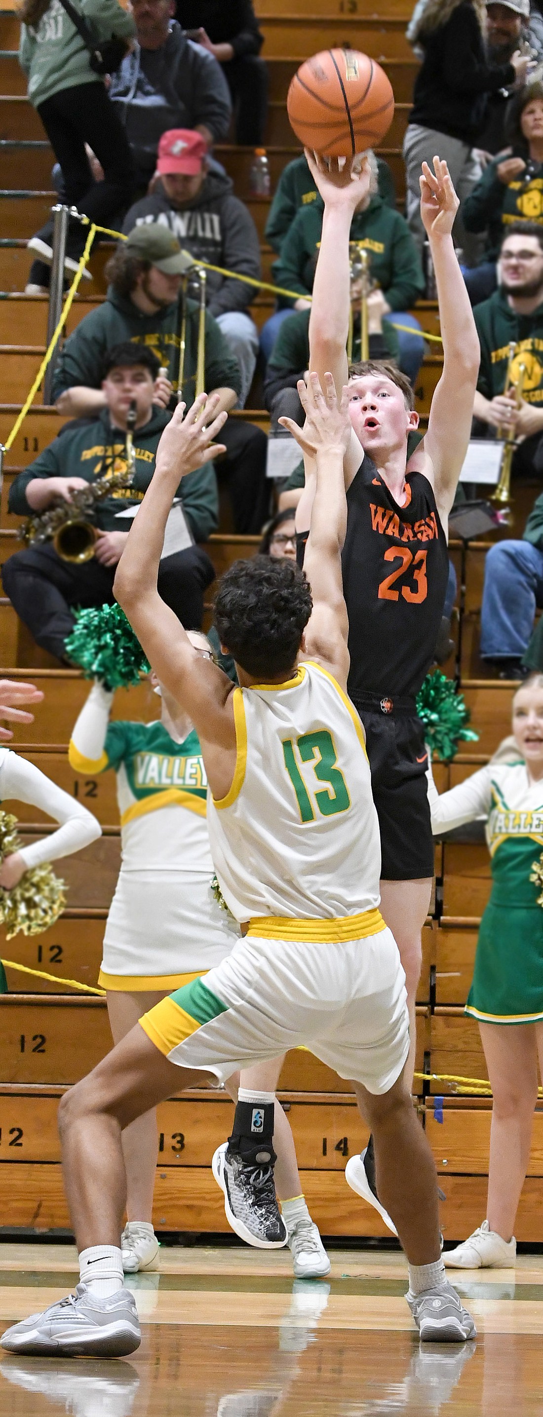 Warsaw junior Brandt Martin shoots over DeOndre Hamilton of Tippecanoe Valley during the second quarter. Photo by Gary Nieter