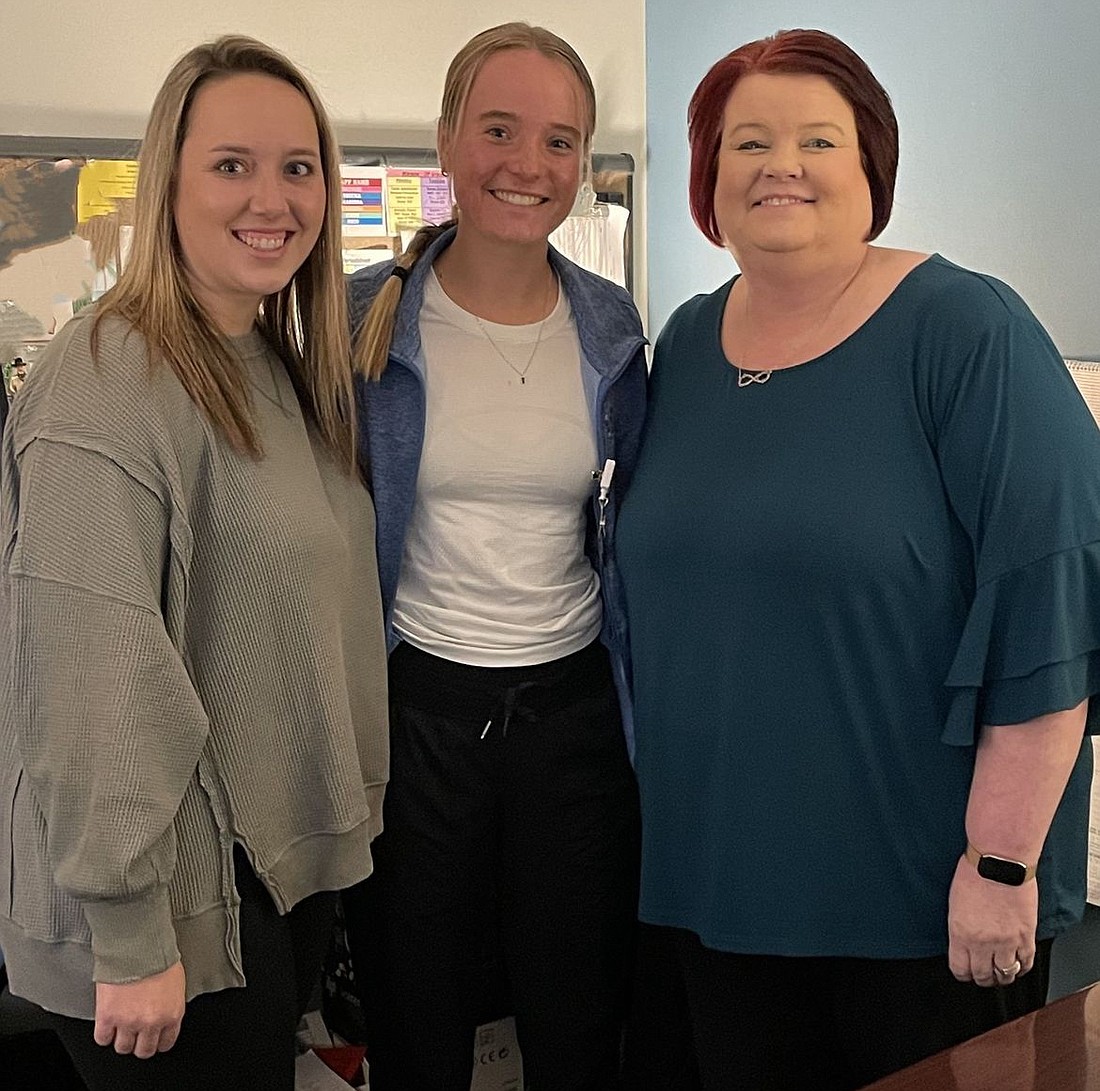 Pictured are Macy Carlile (C) with Julie Foster and Jennifer Hatcher of The Bowen Center. Photo Provided.